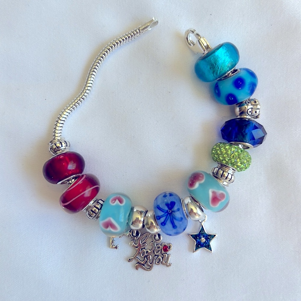 Pandora-like Sterling bracelet with Sterling charms. Very cute!!